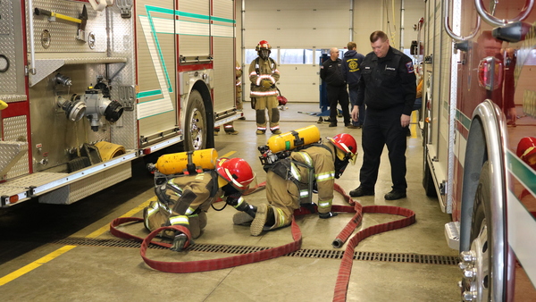 Firefighting students practice fire drills.