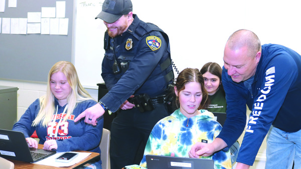 Law Enforcement students practice how to write incident reports.