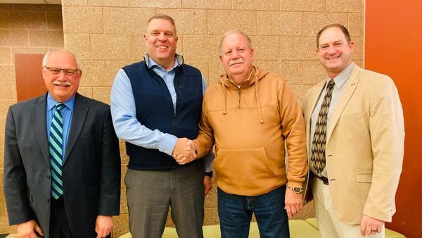 Board President Paul Toliver, Deputy Superintendent Dr. Tom Bruce, and Superintendent Dave Eichberg show their appreciation for Mr. Marschke's board service.